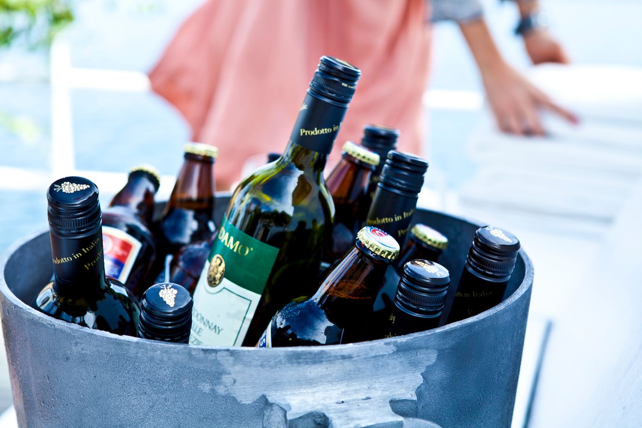 wine and beer bottles in an ice bucket showing alcohol consumption and its relationship to joint health