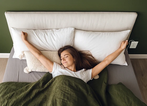lifestyle photo of BareEarth grounding sheets on a bed showing earthing sleep setup for inflammation and sleep quality improvement