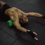 man using foam roller for muscle recovery after exercise