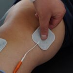 physical therapy treatment with electrical stimulation on knee joint