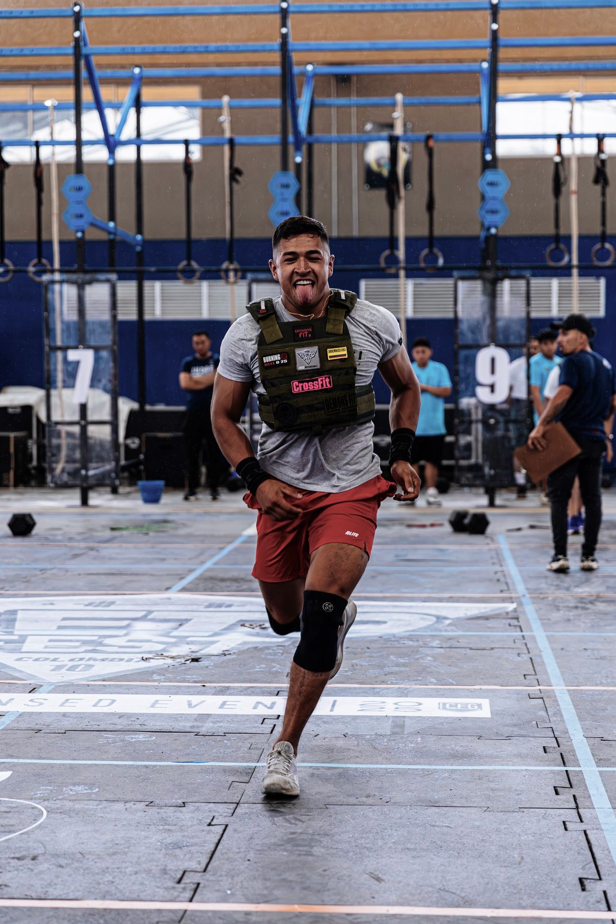 athlete in CrossFit event wearing knee brace for joint support
