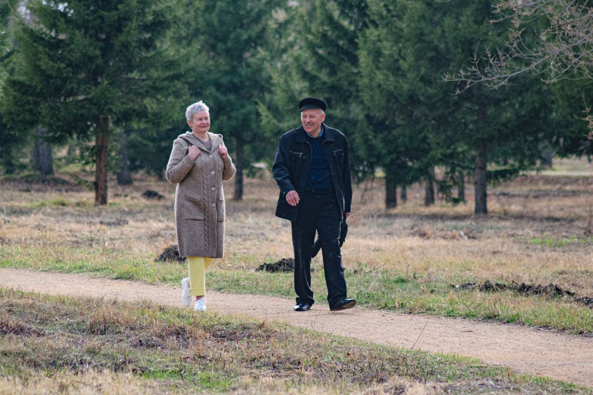 couple walking outdoors for low impact joint health exercise after 40
