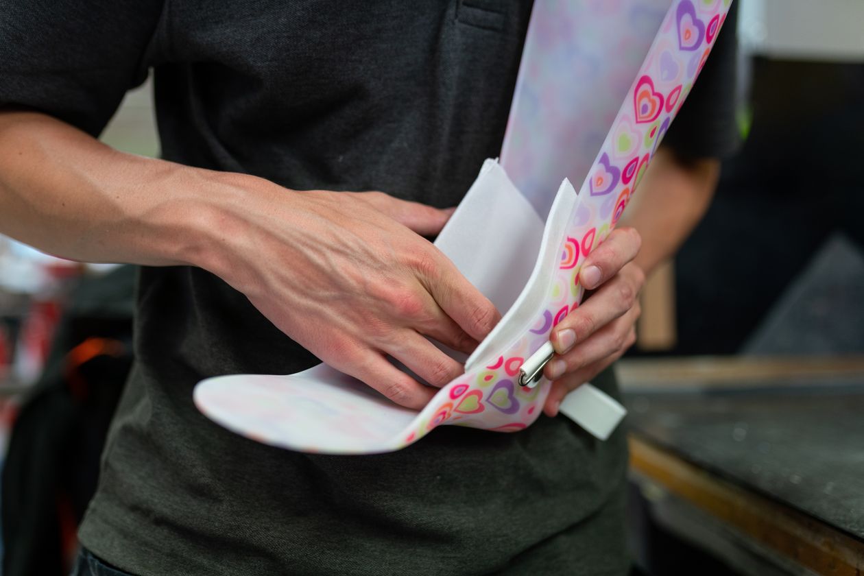 technician designing a custom orthotic ankle-foot brace showing precision craftsmanship