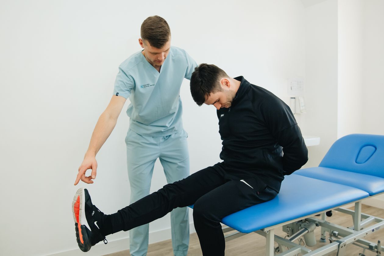 physiotherapist instructing a patient on rehabilitation exercises for sciatica and back pain