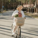 elderly woman riding bicycle outdoors active lifestyle after 40