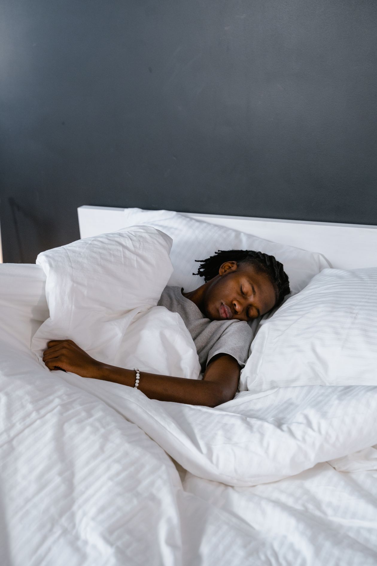 person sleeping comfortably with proper pillow support for neck and back alignment