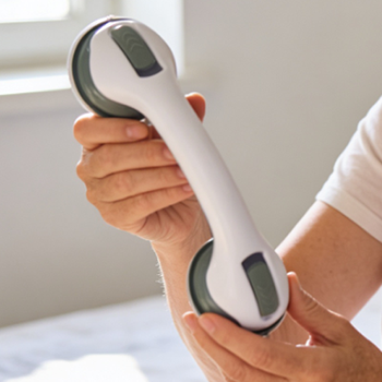 customer using UltraGrip Assist portable grab bar in bathroom showing real-world use for balance support and fall prevention