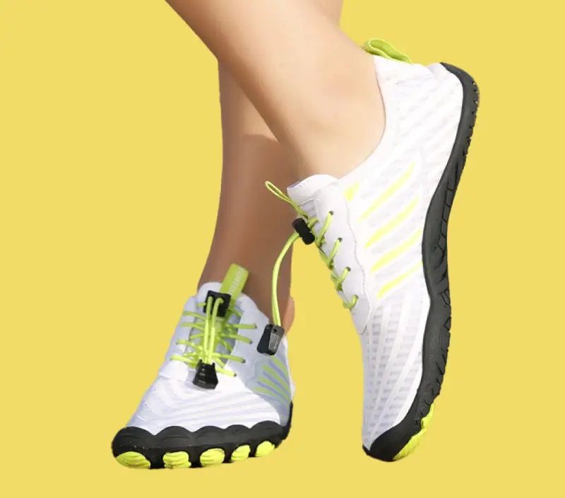Adult wearing Grounded Footwear barefoot shoes showing natural foot position and ground contact for joint health