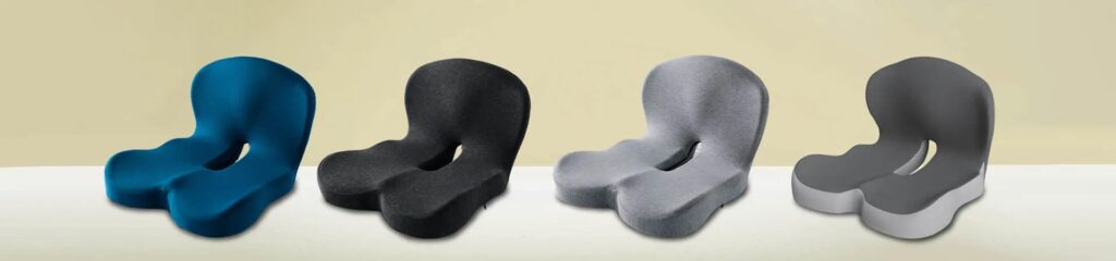 Hewelth LumboCare Pro one-piece orthopedic cushion in teal, black, light grey and dark grey with a contoured seat, U-shaped tailbone cutout and curved back-support panel