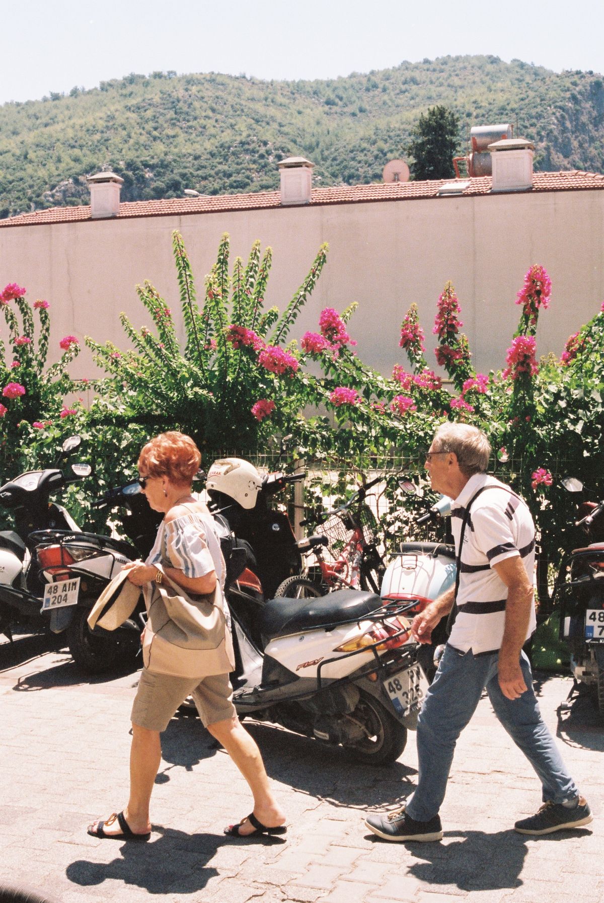 Senior couple walking outdoors, illustrating walking speed as an early warning sign of sarcopenia