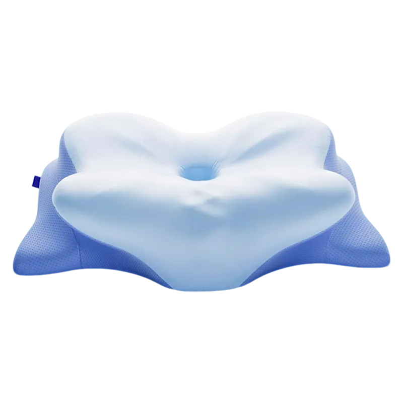 Top view of a butterfly pillow showing four wing-shaped lobes around a lower center with a small airflow hole