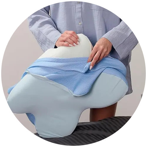 Removing the zippered blue mesh cover from the Hewelth MaxBreath memory foam butterfly pillow for washing
