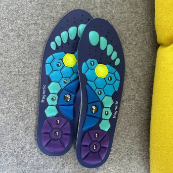 EvoStep insoles placed inside shoes, with the cushion grid covering the full foot surface