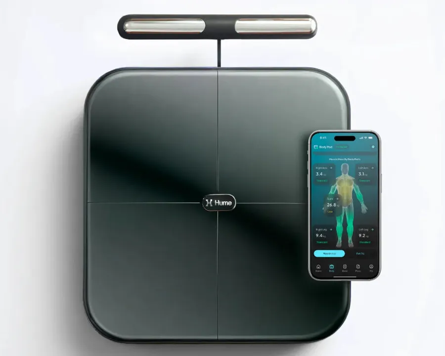 Hume Pod body composition scale with its hand-grip handle and the Hume Health app showing muscle mass by body part