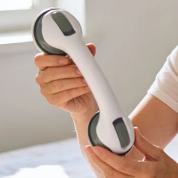 Hands holding the UltraGrip Assist by its ergonomic handle, showing the size of the grip